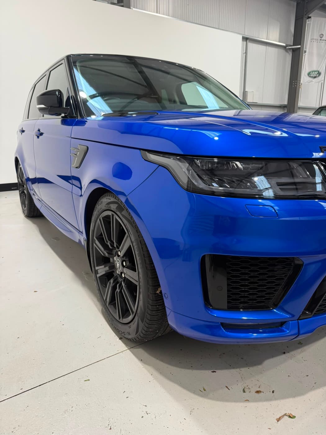 Bright blue Range Rover Sport detailed to a high gloss