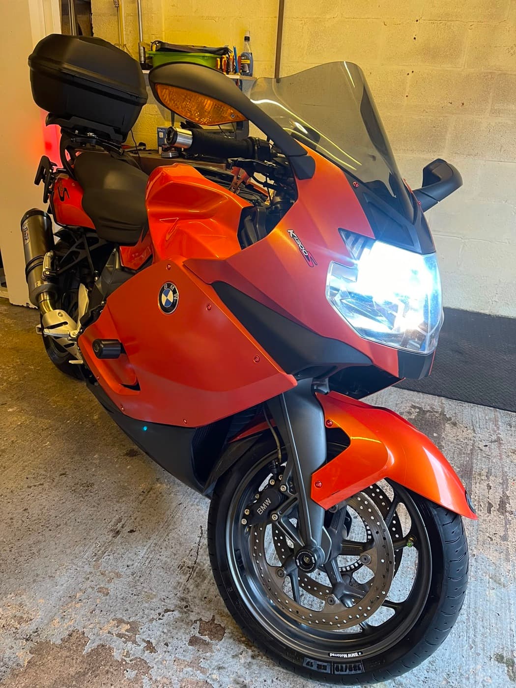 Orange BMW sports motorcycle cleaned and protected